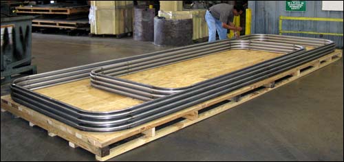 240" long metal bellows with round corners designed to be installed at the ductwork connection to a large steam boiler.